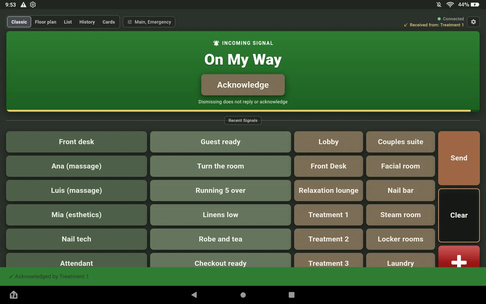 The Fire HD 10 showing the reply On My Way as an incoming signal with an Acknowledge button under it, above the Classic board.