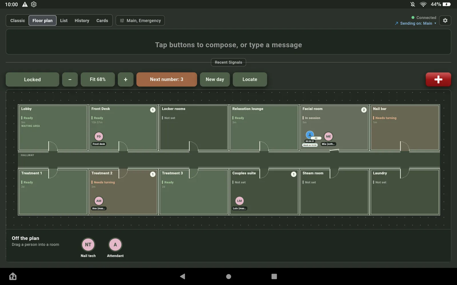 The Floor plan view on the Fire HD 10 in Spa Dim: twelve rooms around a hallway, guest 2 with Mia in the Facial room, Ana in Treatment 2, Luis in the Couples suite.